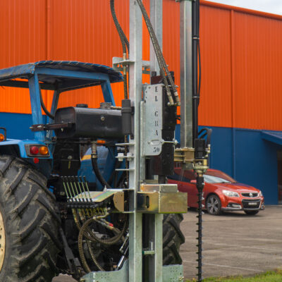 Elgra post driver - series 89 attached to tractor on grass